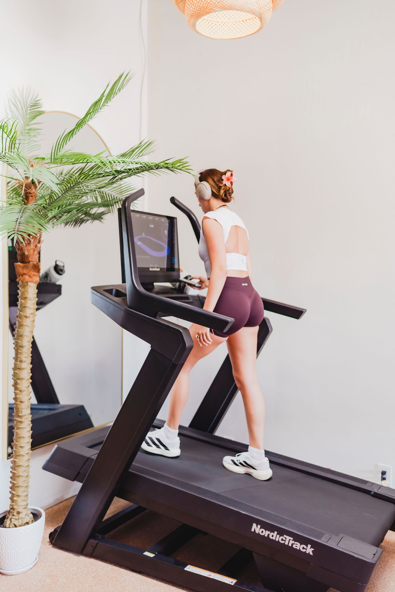 Member walking on treadmill